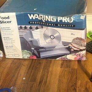 Brand new in the box, professional quality Silver Food Slicer!